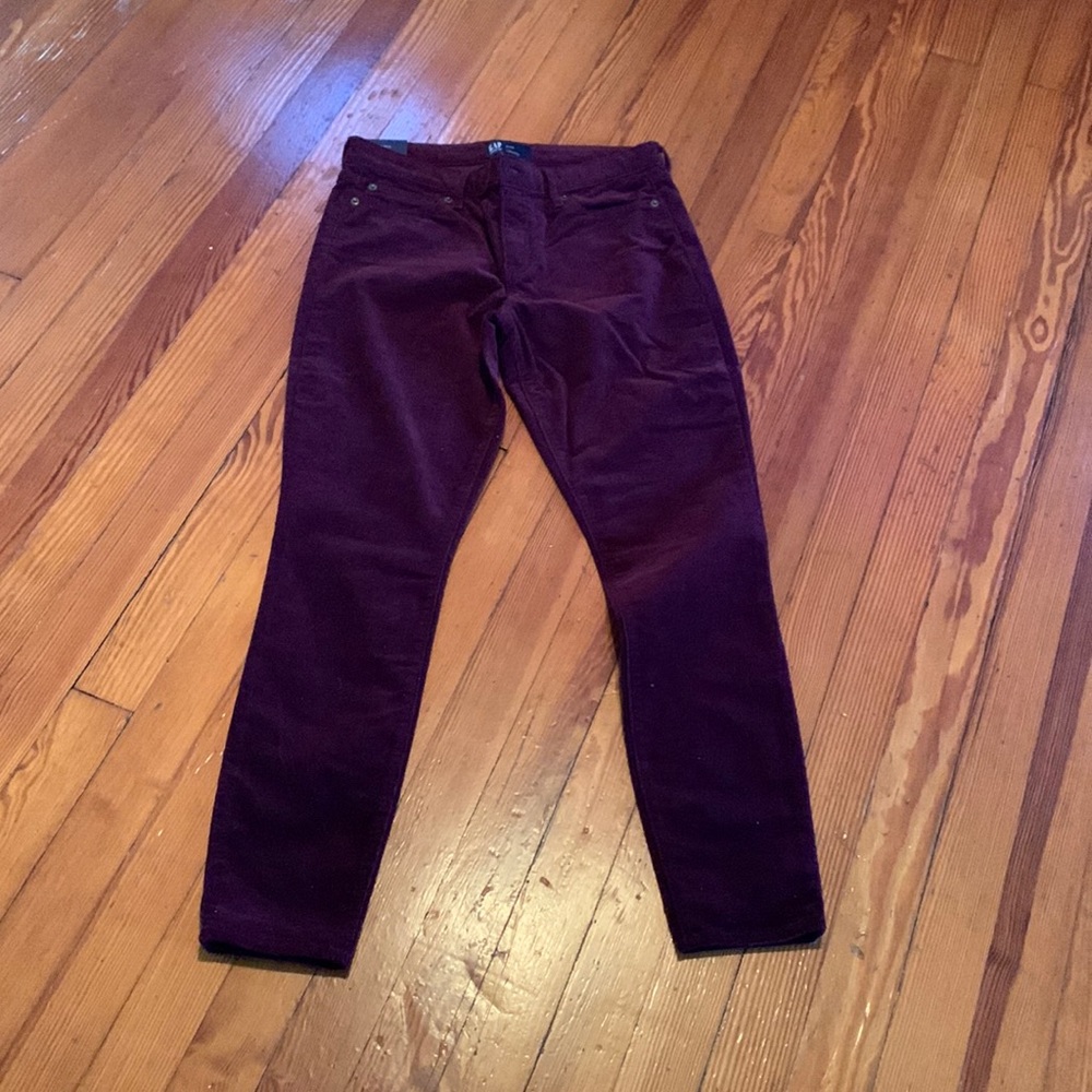 Burgundy skinny corduroy pants from the gap.
